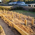 Raised garden beds on sloped ground Gold Coast backyard ideas.